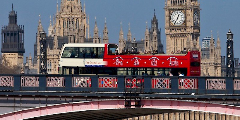 A hop-on/hop-off open-top double decker sightseeing bus crossing London Bridge (Photo Â© The Original London Sightseeing Tour Ltd 2016)