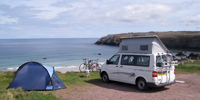 A camper and a tent overlooking a killer whale migration route at Sango Sands Campsite, Durness, Sutherland, Scotland (Photo by John Allen)