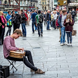 A lone busker entertains the passing crowds in Leicester Square (Photo by Garry Knight)