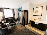 A lofted hotel bedroom